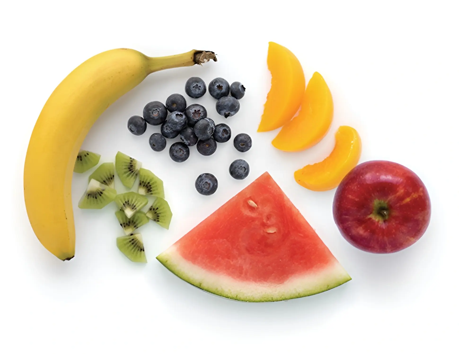 A variety of fresh fruits including banana, blueberries, kiwi, peach, watermelon, and apple.