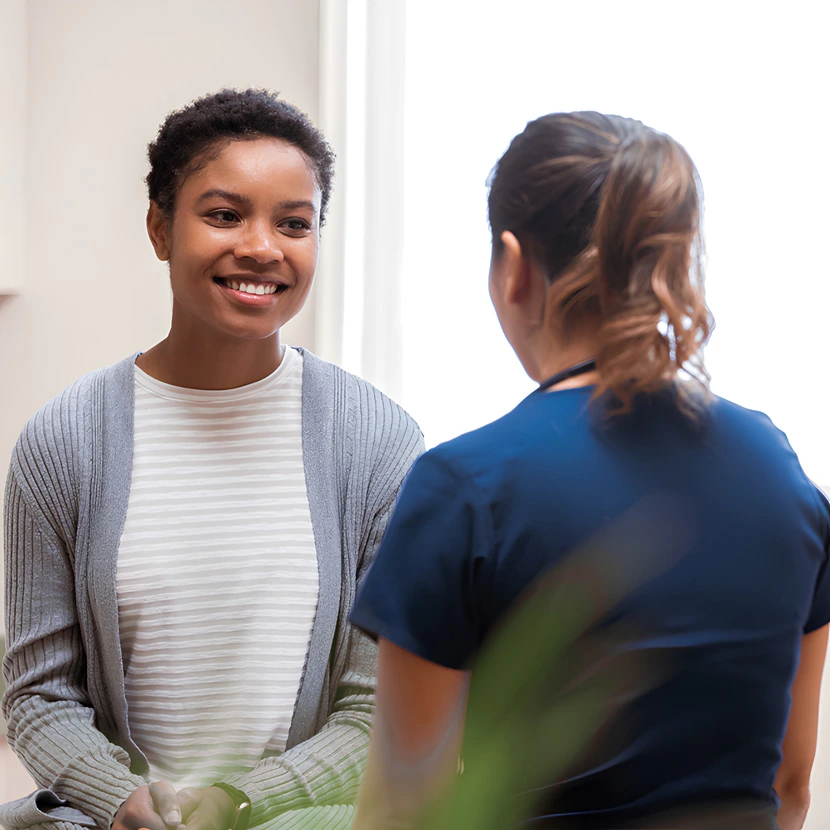 Woman speaking with healthcare provider