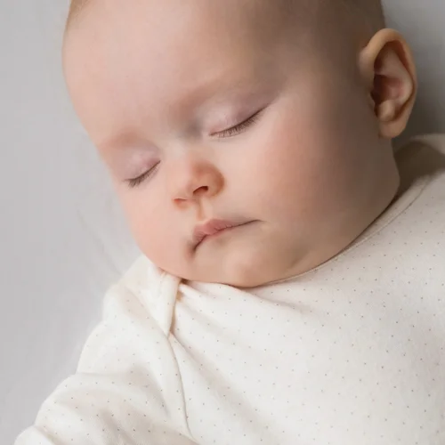 SleepingBabyInCrib