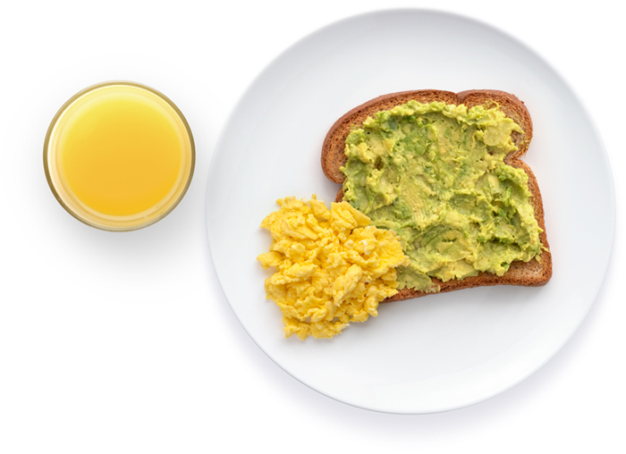 Toast with avocado, scrambled eggs, and orange juice.