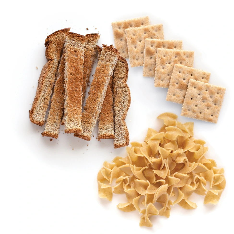 Whole grain toast, pasta, and crackers arranged neatly