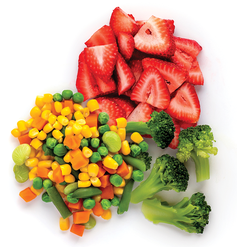 Sliced strawberries, mixed vegetables, broccoli arranged together