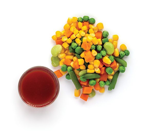 Mixed vegetables and tomato juice on white background